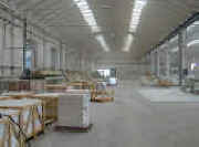 Factory for production of slabs, tiles and cut to sizes.